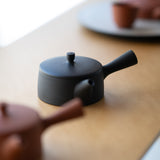 <transcy>Black Cylindrical Teapot</transcy>